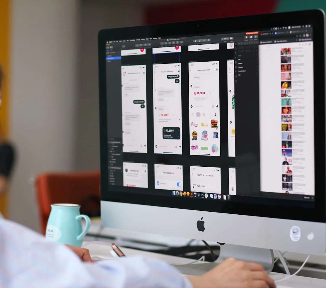 Close-up of hands interacting with a shopping website on a laptop screen indoors.